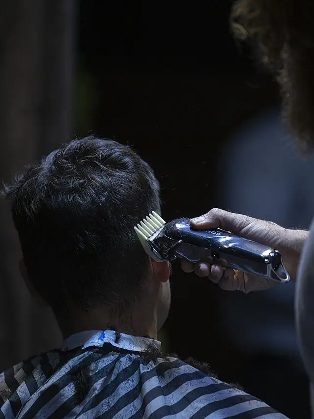 Barber working with clippers